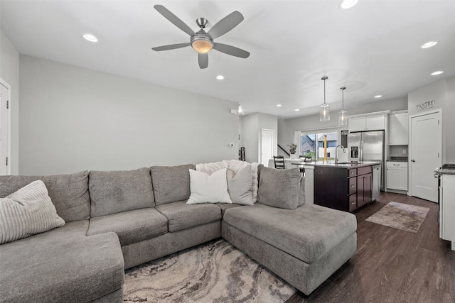 living room with dark wood-style floors, ceiling fan, and recessed lighting