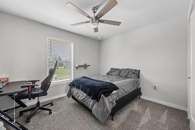 bedroom featuring baseboards, carpet floors, an office area, and ceiling fan