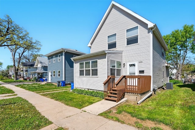 back of property with a yard