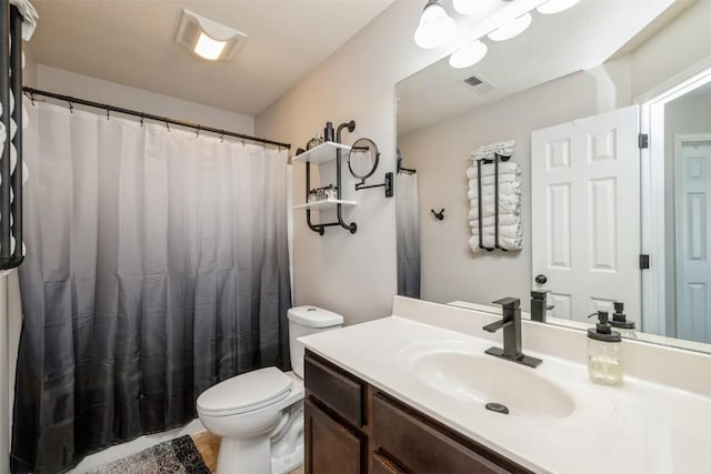 bathroom featuring vanity, toilet, and a shower with curtain