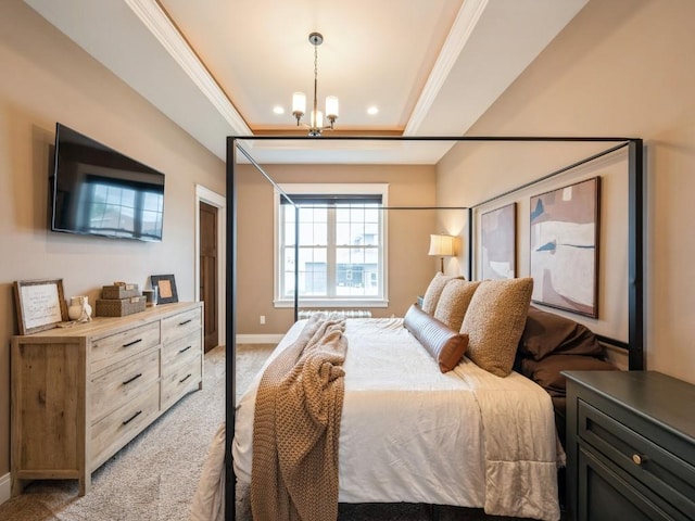 bedroom with a chandelier, light carpet, baseboards, and a tray ceiling