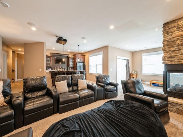 living area with carpet flooring, a fireplace, plenty of natural light, recessed lighting, and baseboards