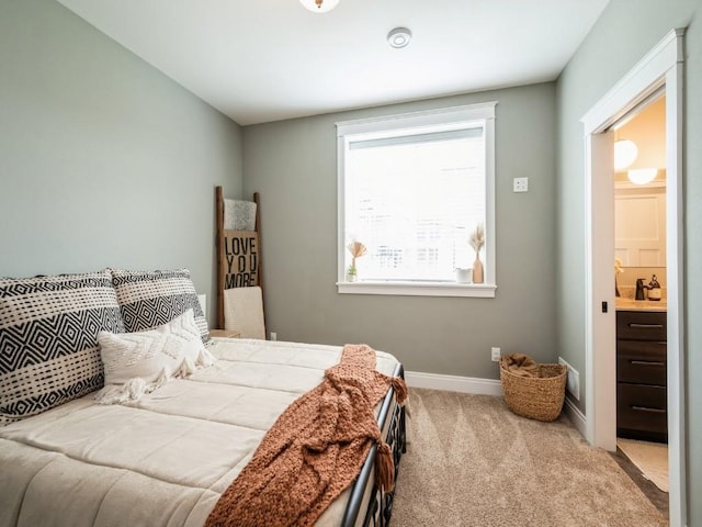 carpeted bedroom with baseboards