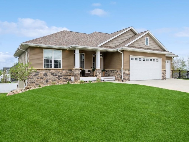 craftsman-style home with a porch, stone siding, an attached garage, and driveway