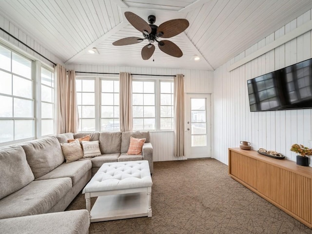 living room with plenty of natural light, ceiling fan, and carpet flooring