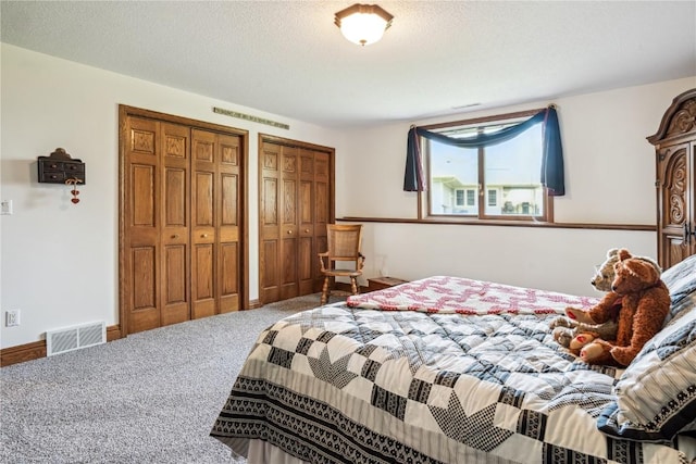4030 Bruce Rd, Marion, IA 52302 - carpeted bedroom featuring multiple closets