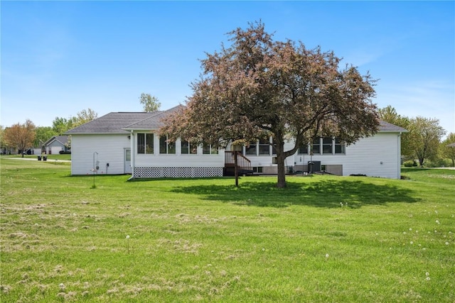 4030 Bruce Rd, Marion, IA 52302 - rear view of property with a lawn and a sunroom