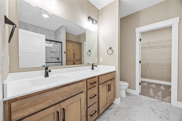 full bathroom featuring marble finish flooring, double vanity, a shower, a spacious closet, and toilet