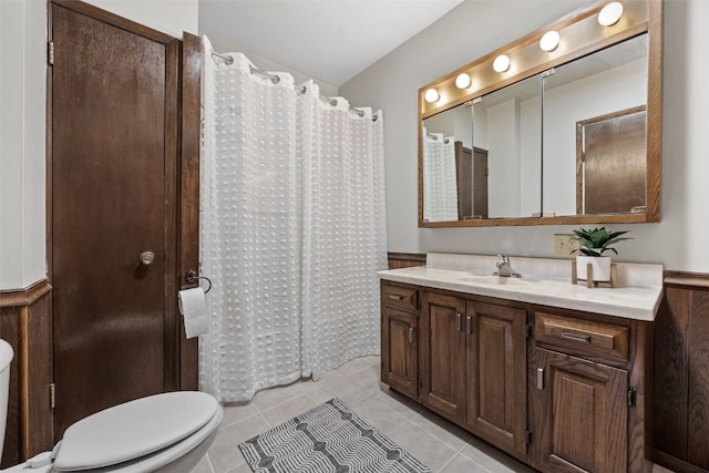 full bath featuring toilet, vanity, tile patterned floors, and a shower with curtain