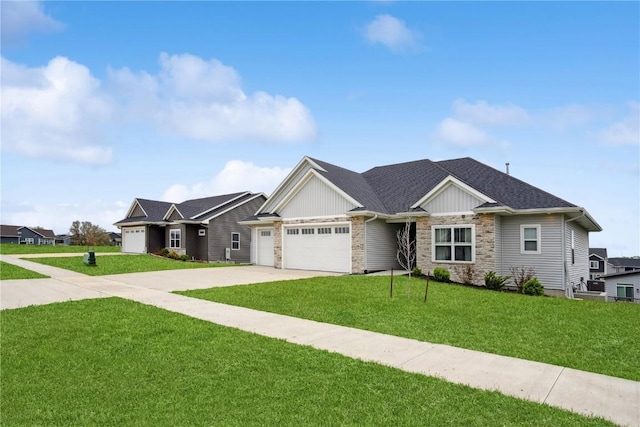view of front of property with stone siding, a garage, concrete driveway, and a front yard