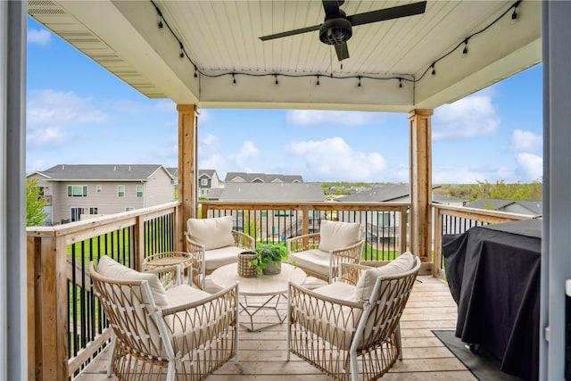 deck featuring ceiling fan, a residential view, grilling area, and an outdoor hangout area