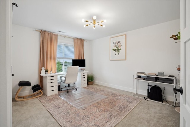 carpeted home office with a chandelier and baseboards