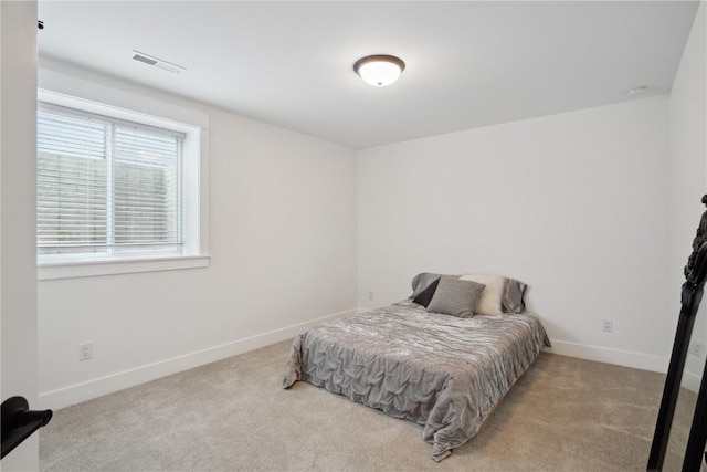 carpeted bedroom featuring baseboards