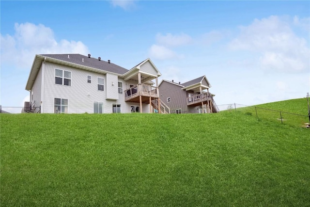 back of property featuring central AC unit and a balcony