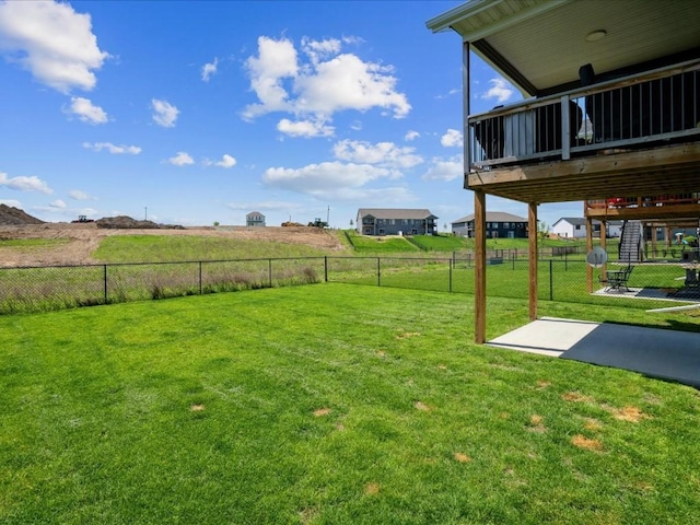 view of yard with a patio and a view of rural / pastoral area
