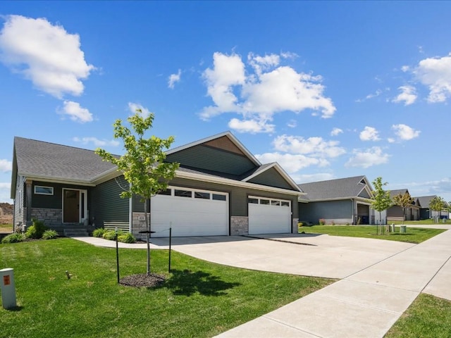view of front of home featuring a garage, concrete driveway, stone siding, and a front lawn