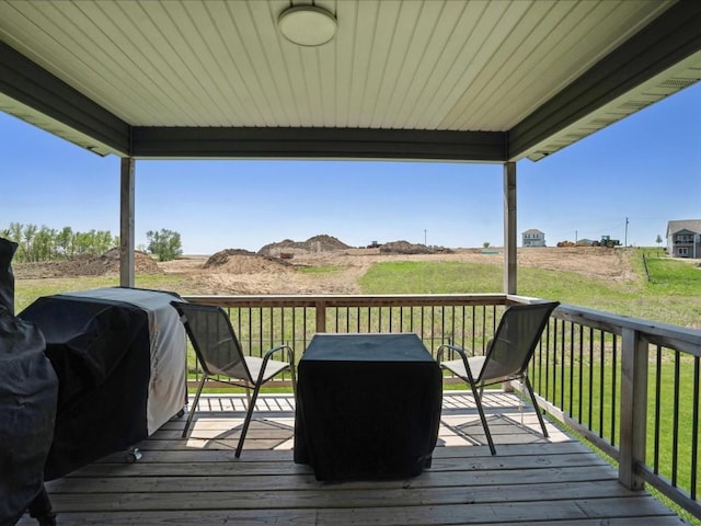 wooden terrace with area for grilling