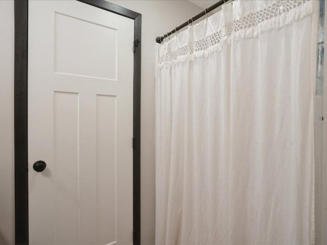 420 Dawson Dr, West Branch, IA 52358 - bathroom featuring a shower with shower curtain