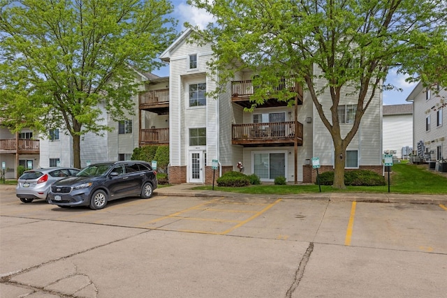 view of property with uncovered parking