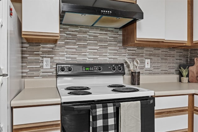 4619 1st Ave SW Unit 3, Cedar Rapids, IA 52404 - kitchen with range with electric cooktop, range hood, light countertops, freestanding refrigerator, and tasteful backsplash