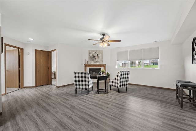 4619 1st Ave SW Unit 3, Cedar Rapids, IA 52404 - living area with wood finished floors, baseboards, ceiling fan, a glass covered fireplace, and recessed lighting