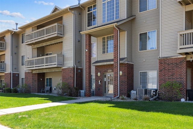 250 Cimarron Dr Unit 207, Hiawatha, IA 52233 - view of building exterior with central AC unit