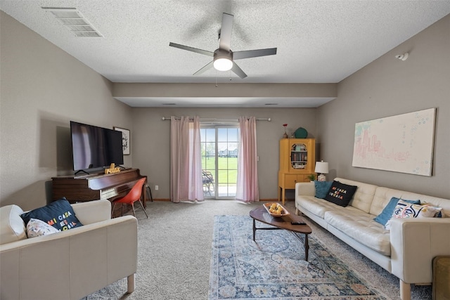 250 Cimarron Dr Unit 207, Hiawatha, IA 52233 - living area with a ceiling fan, carpet, a textured ceiling, and baseboards