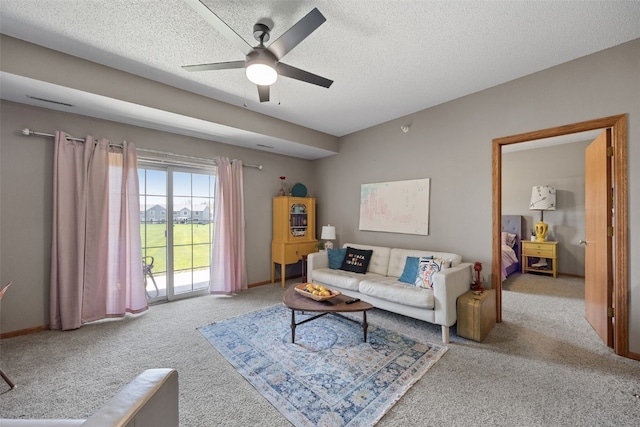 250 Cimarron Dr Unit 207, Hiawatha, IA 52233 - living area with carpet floors, a ceiling fan, a textured ceiling, and baseboards