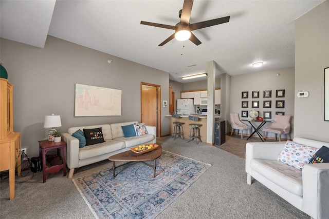 250 Cimarron Dr Unit 207, Hiawatha, IA 52233 - living room featuring carpet and a ceiling fan