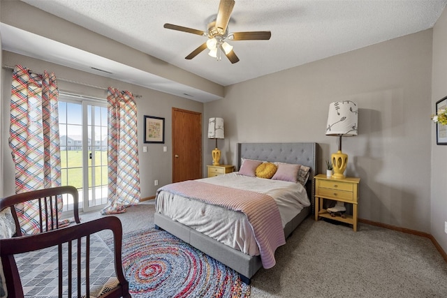 250 Cimarron Dr Unit 207, Hiawatha, IA 52233 - carpeted bedroom featuring baseboards, access to outside, and a ceiling fan