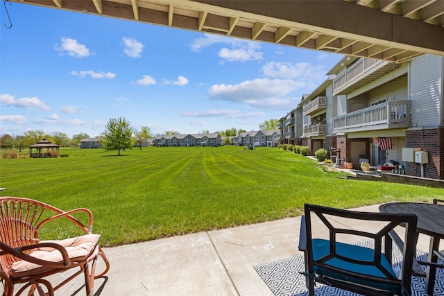 250 Cimarron Dr Unit 207, Hiawatha, IA 52233 - view of patio featuring a residential view