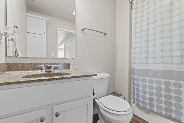 1227 Mary Ln, North Liberty, IA 52317 - full bathroom featuring a shower with curtain, toilet, and vanity