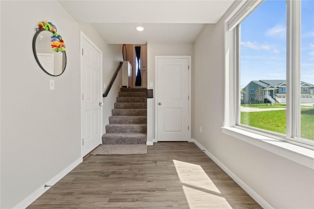 1227 Mary Ln, North Liberty, IA 52317 - entryway featuring baseboards, wood finished floors, stairs, and recessed lighting