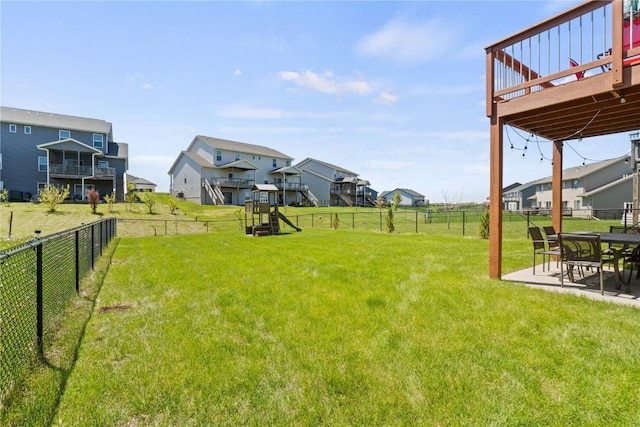 1227 Mary Ln, North Liberty, IA 52317 - view of yard featuring a residential view, a deck, and a patio