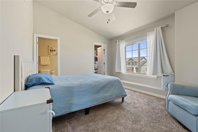 1227 Mary Ln, North Liberty, IA 52317 - bedroom featuring carpet flooring, vaulted ceiling, ensuite bathroom, a walk in closet, and a ceiling fan
