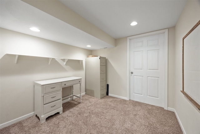 unfurnished office featuring light carpet, recessed lighting, and baseboards