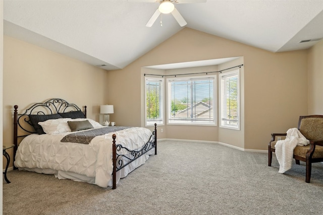 carpeted bedroom featuring vaulted ceiling, a ceiling fan, and baseboards