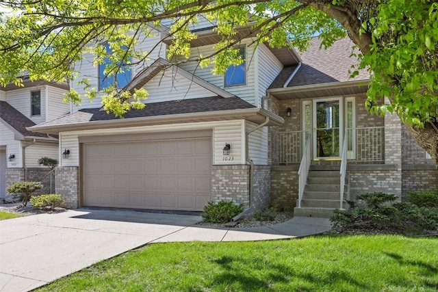 view of front of house with brick siding, concrete driveway, a garage, roof with shingles, and a front lawn