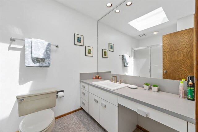 13 Woodland Hts, Iowa City, IA 52240 - bathroom featuring a skylight, recessed lighting, baseboards, a stall shower, and vanity