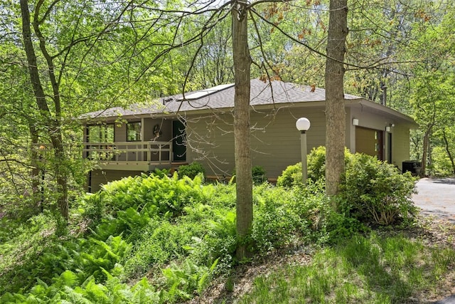 13 Woodland Hts, Iowa City, IA 52240 - view of property exterior featuring driveway and a deck