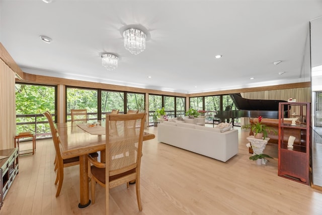 13 Woodland Hts, Iowa City, IA 52240 - dining room featuring light wood-style floors and a chandelier