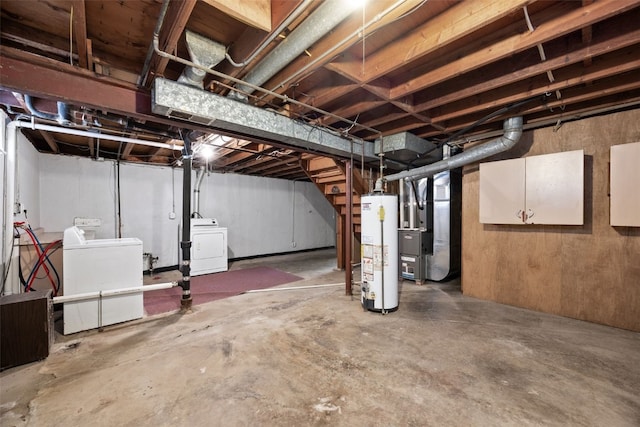 unfinished basement with water heater, independent washer and dryer, and heating unit