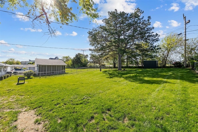 view of yard with an outbuilding and a shed