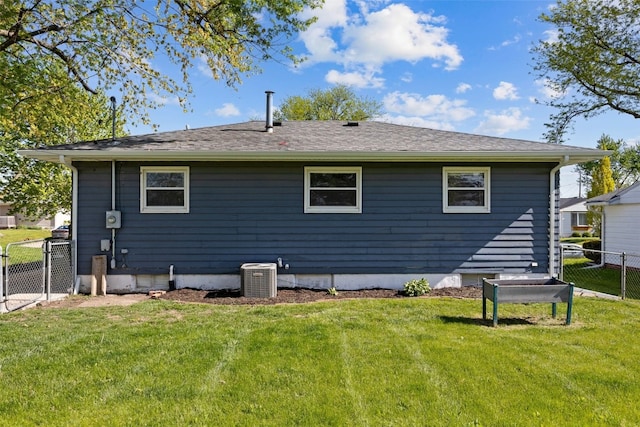 back of house with central AC unit
