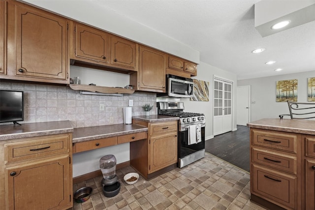 kitchen with appliances with stainless steel finishes, open shelves, brown cabinetry, tasteful backsplash, and recessed lighting