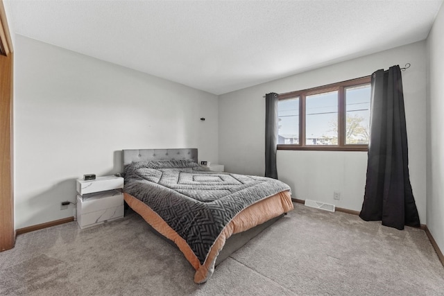 bedroom featuring carpet flooring and baseboards