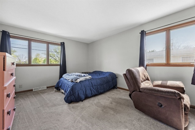 carpeted bedroom with baseboards
