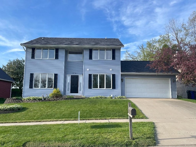 1721 Hidden Hollow Ln, Cedar Rapids, IA 52405 - view of front of home featuring a garage, concrete driveway, and a front lawn