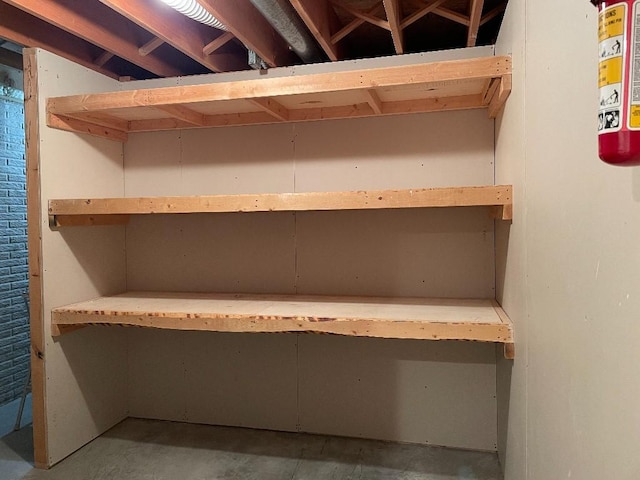 1721 Hidden Hollow Ln, Cedar Rapids, IA 52405 - detailed view of unfinished concrete flooring and a fire extinguisher
