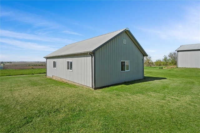 6119 28th Ave Dr, Vinton, IA 52349 - view of pole building featuring a lawn